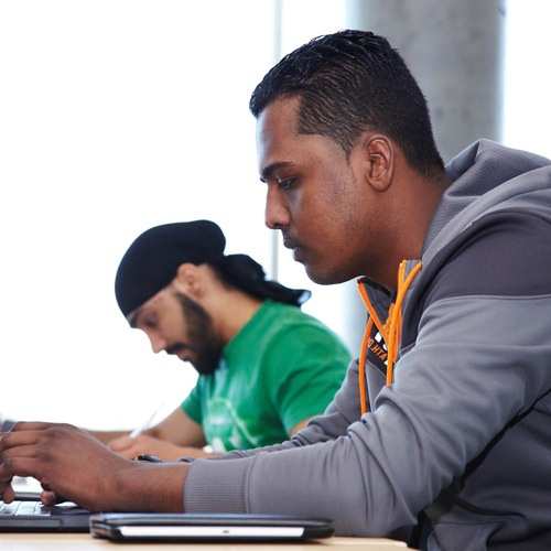 Students typing on computer